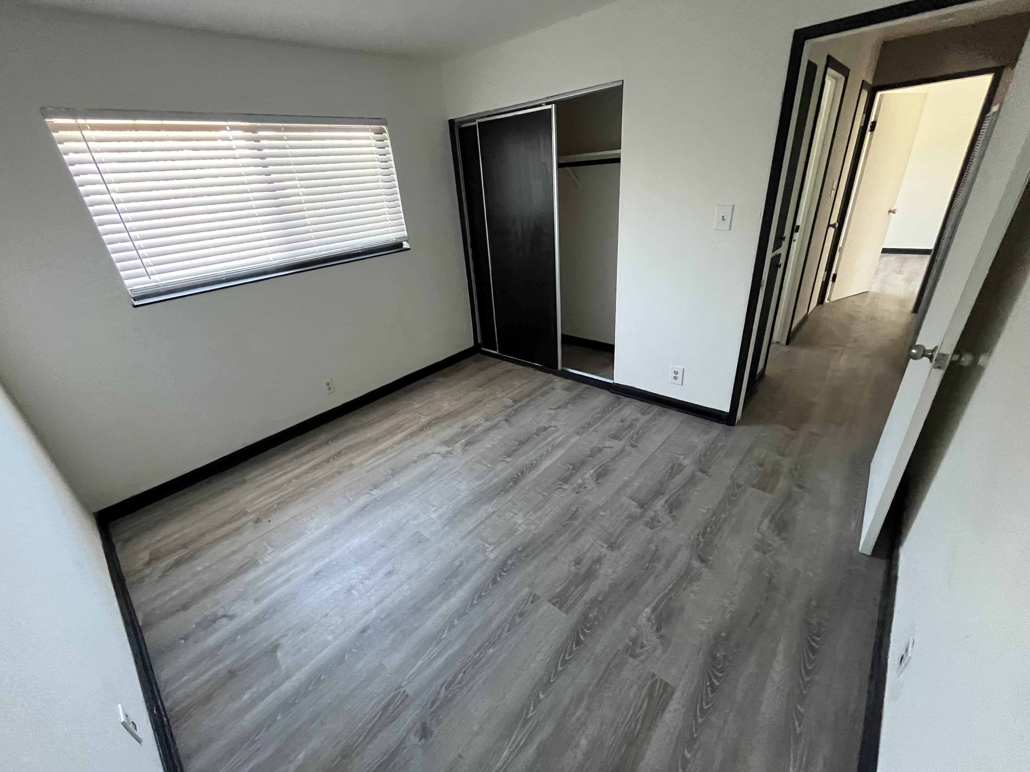 Vinyl plank flooring installation in a bedroom