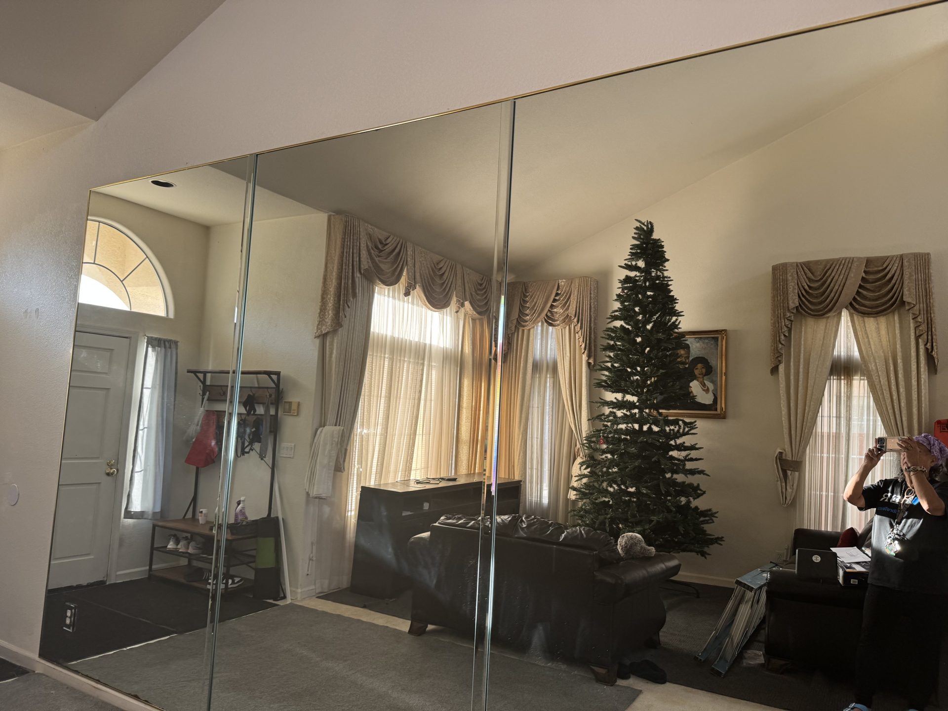 Mirrored sliding closet doors installed in a bedroom